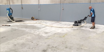 Worker polishing concrete.