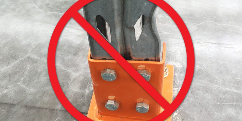 Damaged pallet racking with an x through it.