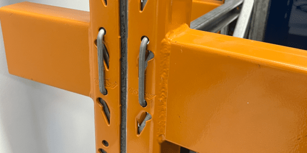 Close up of pallet racking beams connected to uprights.