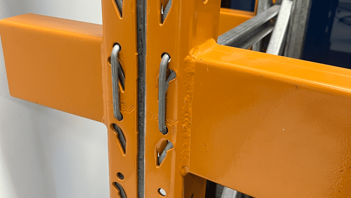 Close up of pallet racking beams connected to uprights.