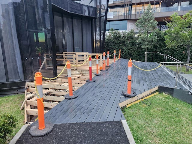 A wooden deck in the process of construction.