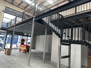 Custom fabricated metal stairway for a mezzanine level.